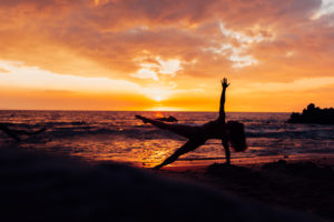 side plank on beach Hawaii